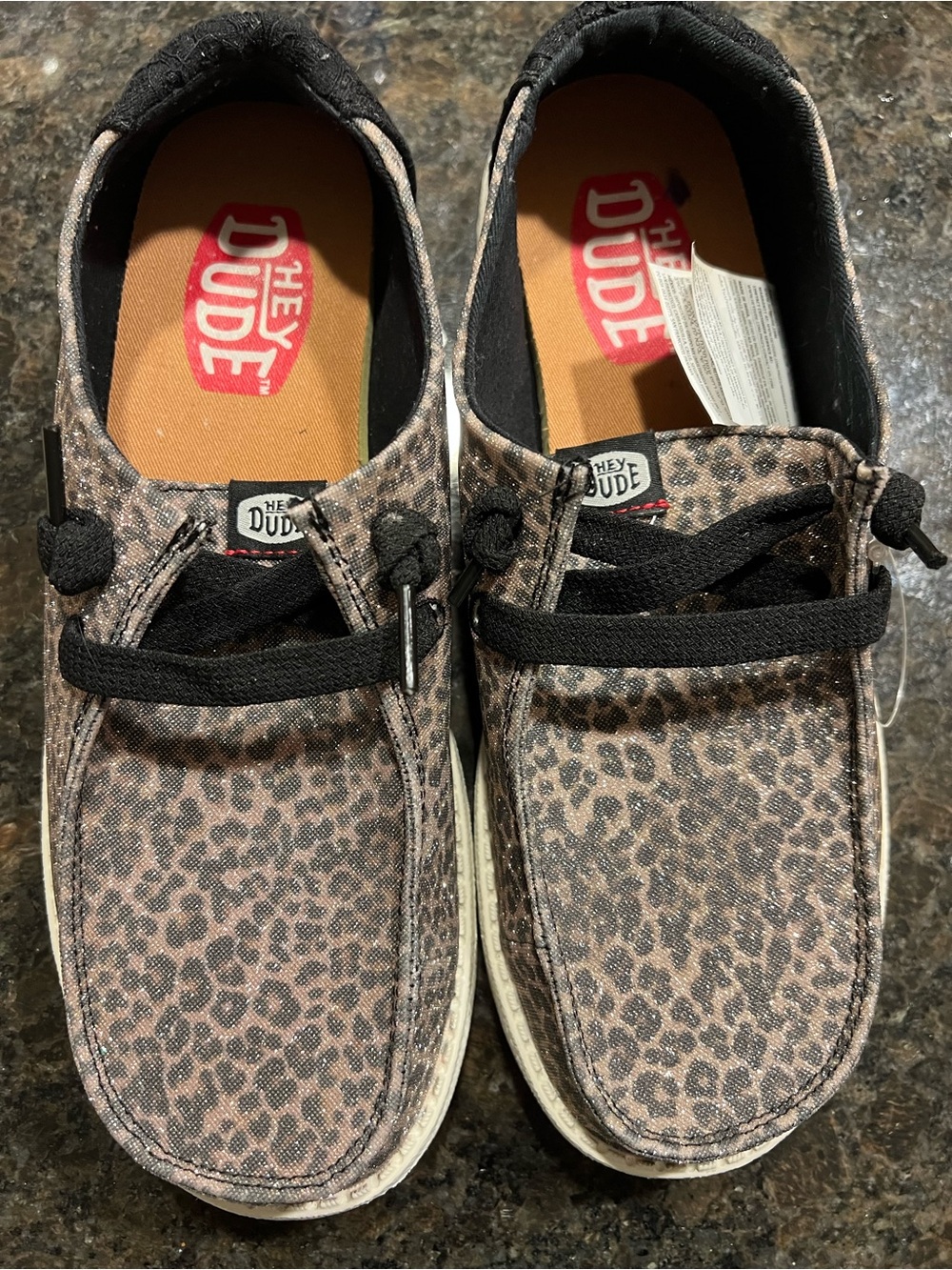 Hey Dude women’s Leopard Print Slip-On Loafers in Brown and Black